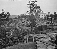 Palisades and chevaux de frise in front of the Potter (or Pondor) House, Atlanta, Georgia, 1864