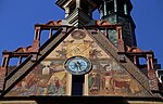 Maßwerk aus Backstein und Terrakotta, Ulmer Rathaus, ein von Fresken bedeckter verputzter Ziegelbau
