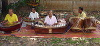 A group of musicians playing traditional Ranat.