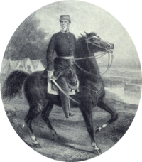 Lithograph depicting a man wearing a military kepi and frock coat with sword in hand and mounted on a black horse