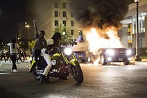 Vehicles on fire during a riot in Washington, D.C., May 30