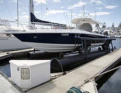 A boat lift is a light duty form of dry dock which keeps small boats out of the water while not in use