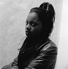 Left side portrait of Foxy Brown looking slightly toward the camera