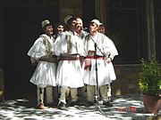 Albanian polyphonic group from Skrapar wearing qeleshe and fustanella