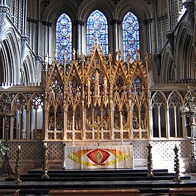 The Gothic Revival reredos at Ely Cathedral, England, with east window behind