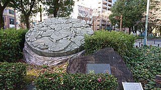 Replica of the Coyolxāuhqui stone disk in Mexico Square at Hisaya Ōdori Park, Nagoya.