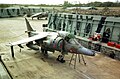 A British Aerospace Harrier GR3 in a revetment at Belize International Airport in 1990