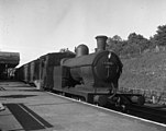 In 1957 a 4-4-2T locomotive of LNER class C13 (GCR Class 9K) waits at Chesham with a train for Chalfont & Latimer