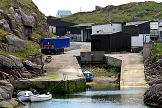 Small scale fish factory next to a pier at the NW end of the main road on the Kincasslagh Peninsula.