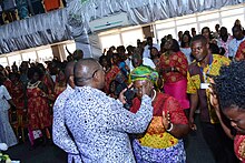 image of modern-day African service in Ghana with laying on of hands