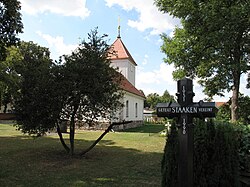 Village church with commemoration cross to Staaken's division from 1951 to 1990