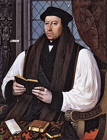 Portrait of Archbishop Cranmer as an elderly man. He has a long face with a large nose, dark eyes and rosy cheeks. He wears clerical robes with a black mantle and brown vestments over full white sleeves and has a doctoral cap on his head. He holds a liturgical book in his hands.