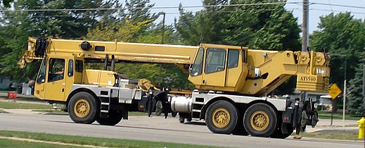 A truck-mounted crane in road travel configuration