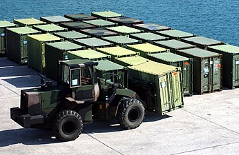 U.S. Navy tractor moves Quadcon containers at Kin Red Port in Okinawa (2005)