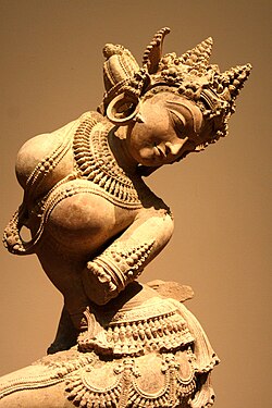 An Apsara depicted here as a dancing celestial female spirit, a medieval (12th-century) sandstone statue from Kannauj