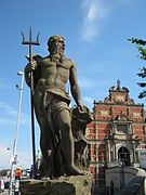 Statue of Neptune at the left side of the ramp