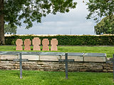 Plaques with the names of identified soldiers killed in action in the community graves (in front of the stone crosses)