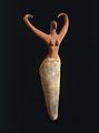 Image 26Naqada figure of a woman interpreted to represent the goddess Bat with her inward curving horns. Another hypothesis is that the raised arms symbolize wings and that the figure is an early version of the white vulture goddess Nekhbet, c. 3500–3400 B.C.E. terracotta, painted, 11+1⁄2 in × 5+1⁄2 in × 2+1⁄4 in (29.2 cm × 14.0 cm × 5.7 cm), Brooklyn Museum (from Prehistoric Egypt)