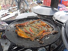 Fish frying in a tawa