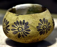 Pottery bowl with a rounded bottom and monochrome paint (rosettes); c. 5000 BC; Telul eth-Thalathat; Iraq Museum