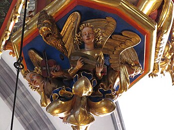 Musician angel decorating the organ