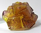 A golden yellow with hints of purple fluorite