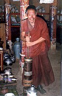 Monk churning butter tea