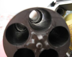 Closeup of the cylinder (carbine model pictured), showing the choked chambers that prevent loading .454 Casull rounds into non-magnum models