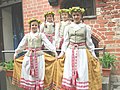 Girls wearing regional Aukštaičių-style folk dresses in Kaunas