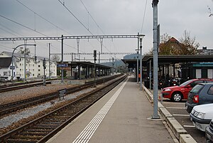 Double-tracked railway line flanked by platforms