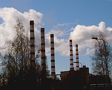 A colour photograph of the Balti Power Station, highlighting its towers against a partly cloudy sky