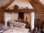 A fireplace in a German castle showing a brick hob.