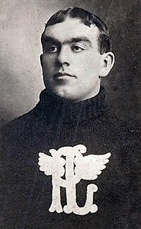 Profile photo of a young man wearing a sweater with a logo on his chest