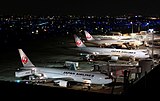 Multiple Japan Airlines aircraft parked at Terminal 1