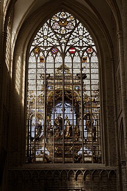 Northern transept: stained glass window by Jan Haeck after Bernard van Orley depicting Charles V (1537)