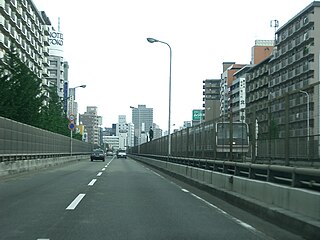 Japan National Route 423 in Kita-ku, Osaka with the Osaka Metro Midōsuji Line in the median.