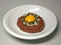 Steak tartare is a meat dish made from finely chopped or minced raw beef, venison, or horse meat.[4][5][6]