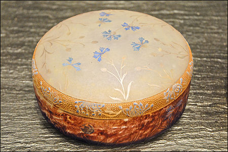 Daum candy container with cornflower design of engraved glass, enamel, and gold (1901)