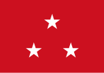 Red flag with three white five-point stars in a centered triange arrangement, peak upward
