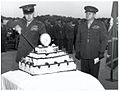 Franklin A. Hart cuts a cake for The Basic School while David M. Shoup looks on in 1951. Note that this cake has candles.