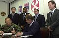 Image 18National Federation of Federal Employees officials sign a collective bargaining agreement with the U.S. 8th Army in October 2002.
