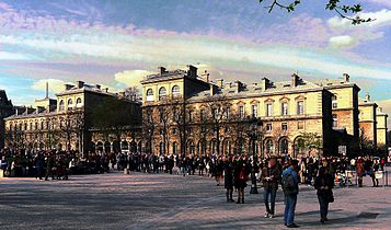 The Hotel-Dieu de Paris, the oldest hospital in Paris, next to the Cathedral of Notre Dame on the Île de la Cité, was enlarged and rebuilt by Haussmann beginning in 1864, and finished in 1876. It replaced several of the narrow, winding streets of the old medieval city.