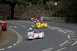Racing sidecar outfits approaching camera position about to enter the left part of the bridge section
