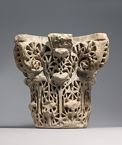 Islamic Composite capital with Arabic-inscribed abacus, probably from Medina Azahara in the Umayyad Caliphate of Córdoba, 10th century, marble, Metropolitan Museum of Art, New York