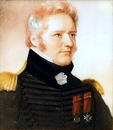 Head and shoulders painting of de Salaberry; fair skin and fair hair; wearing a black military uniform with two medals on his chest