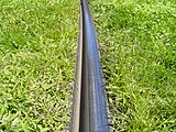 Grooved tram tracks in grass
