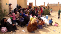 Refugees fleeing the clashes in Tabqa