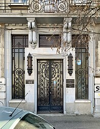 Art Deco door with spirals and sinuous lines, of the Mihai Zisman House (Calea Călărașilor no. 44) in Bucharest, by Soru (1920)