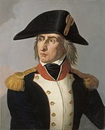 Color print of an angry looking man with a long nose and long hair. He wears a large bicorne hat and a dark blue military coat with white lapels, gold epaulettes and a red collar.