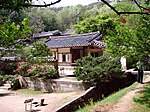 Traditional Korean buildings surrounded by trees